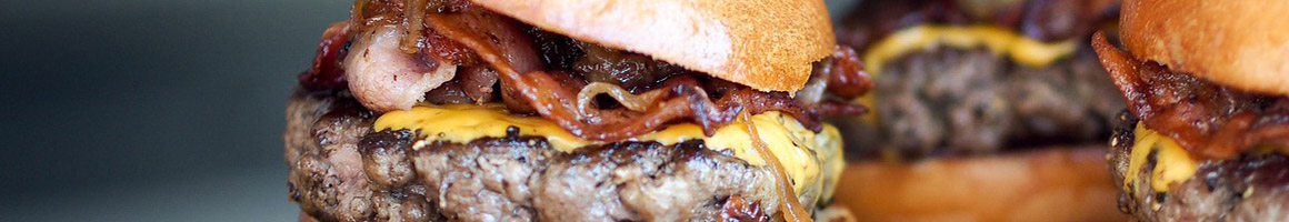 Eating Burger at Omega Burgers Lakewood restaurant in Lakewood, CA.